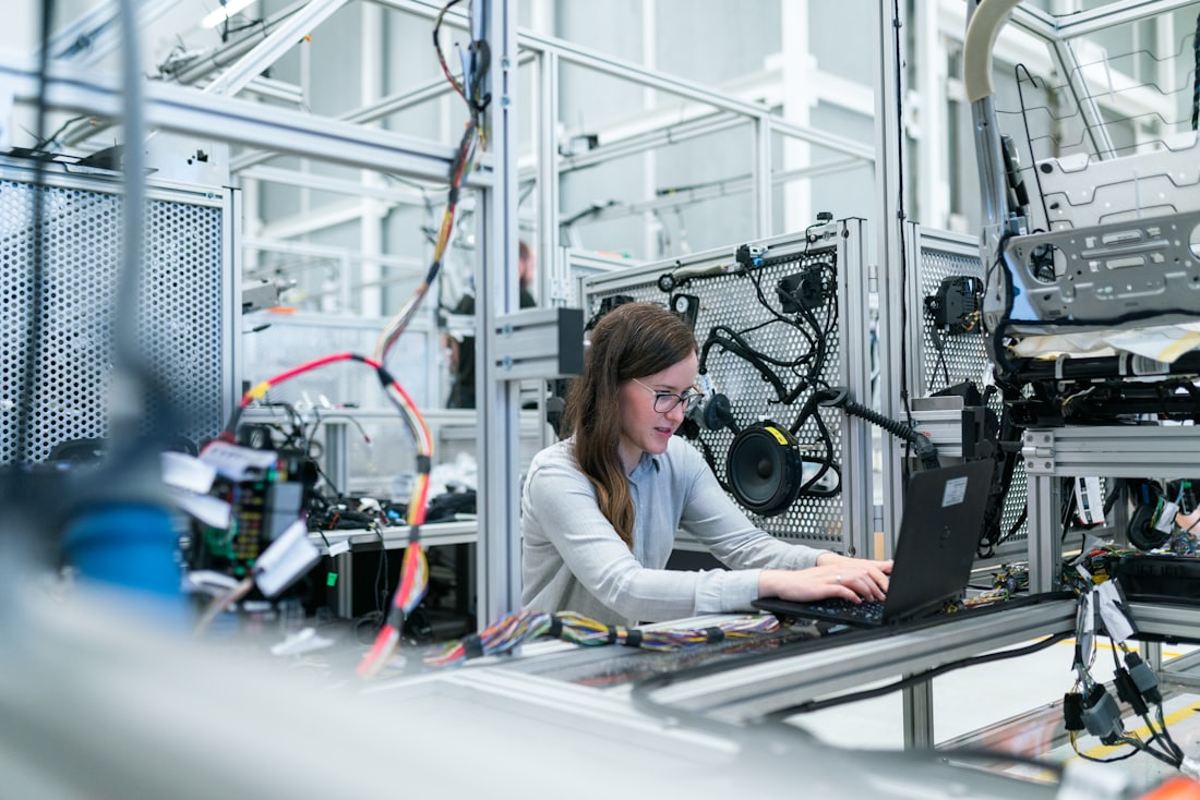 Engineer analysing components at a workstation